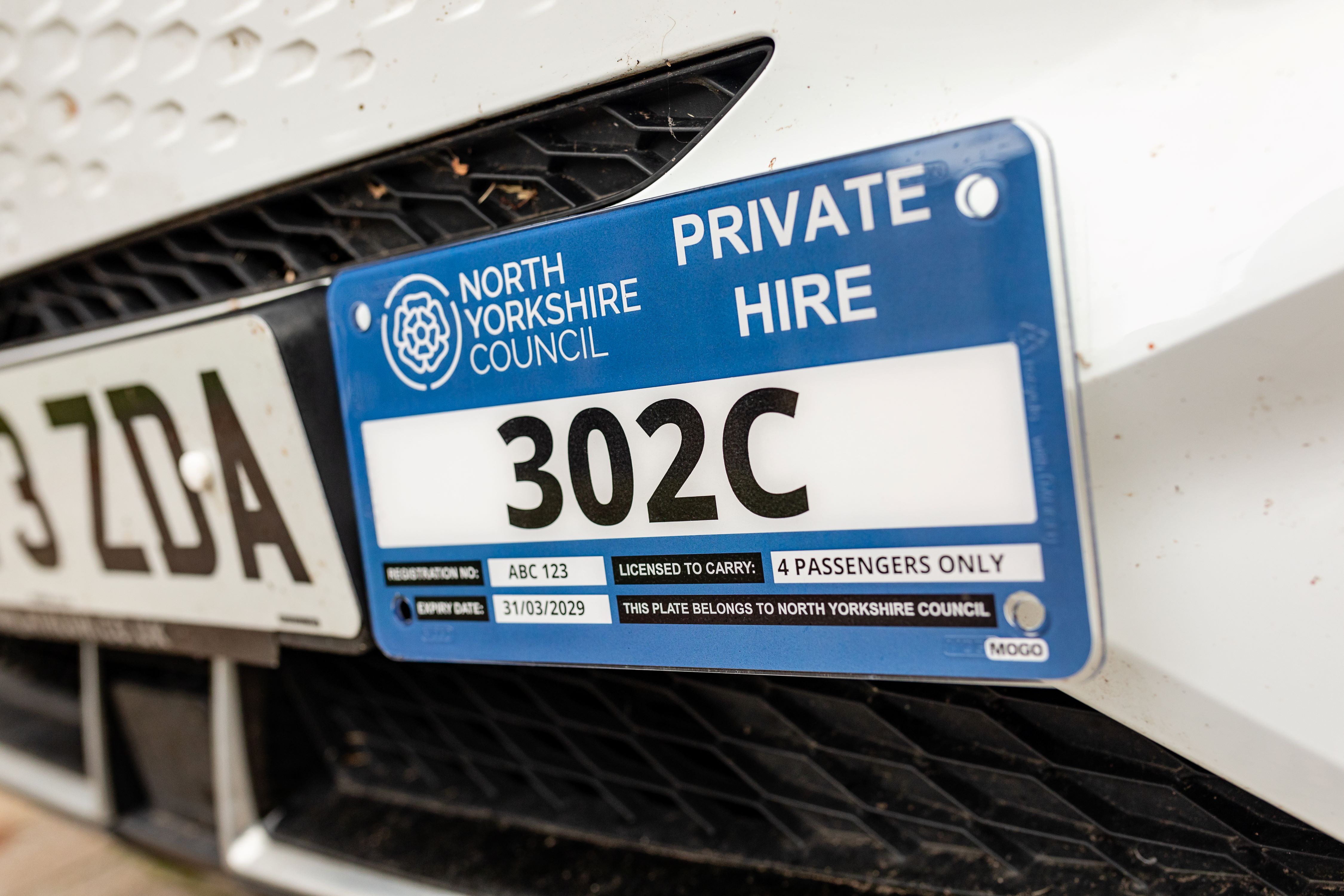 A taxi license plate