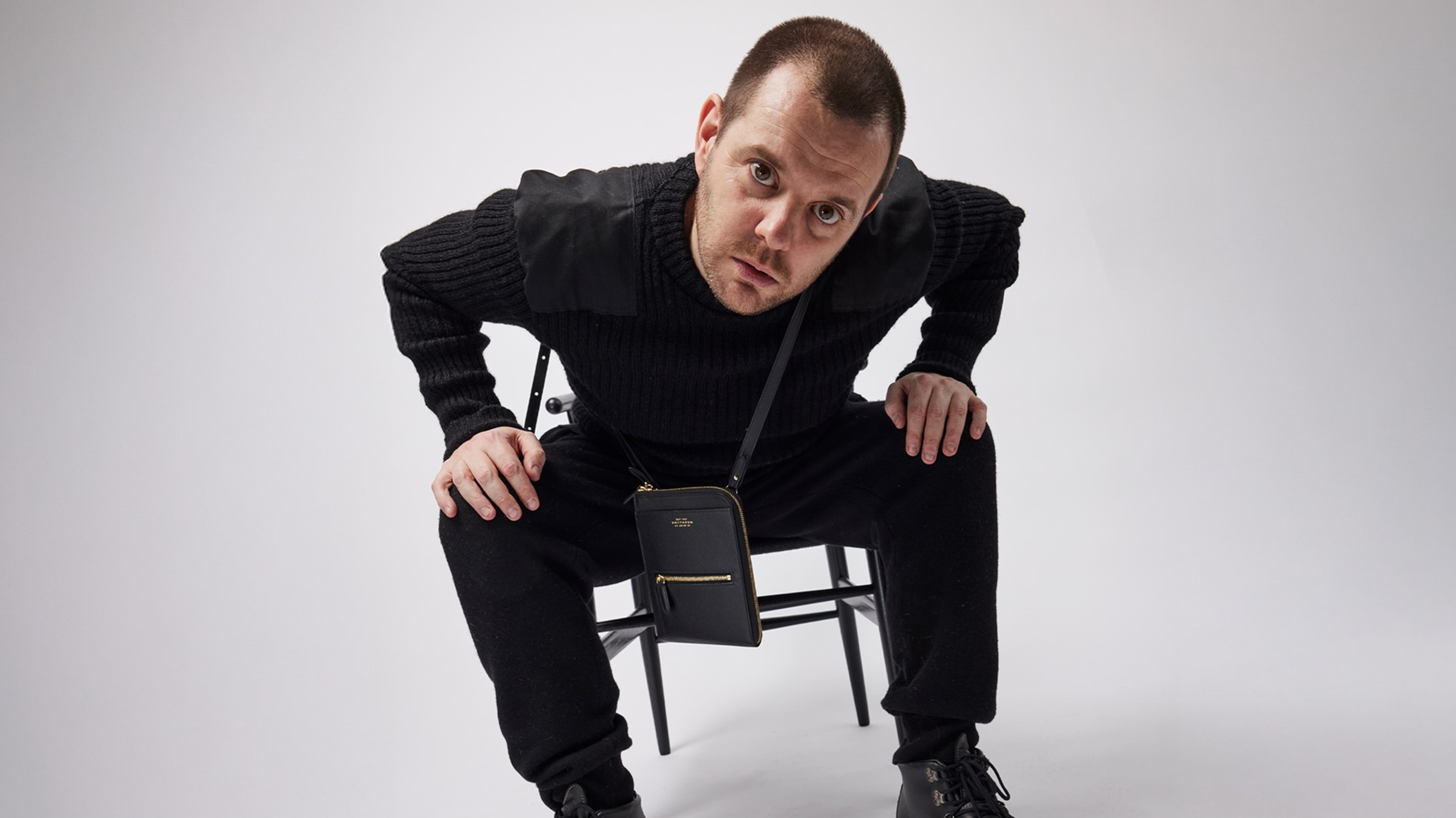 The Streets, Mike Skinner sitting in a chair looking at the camera