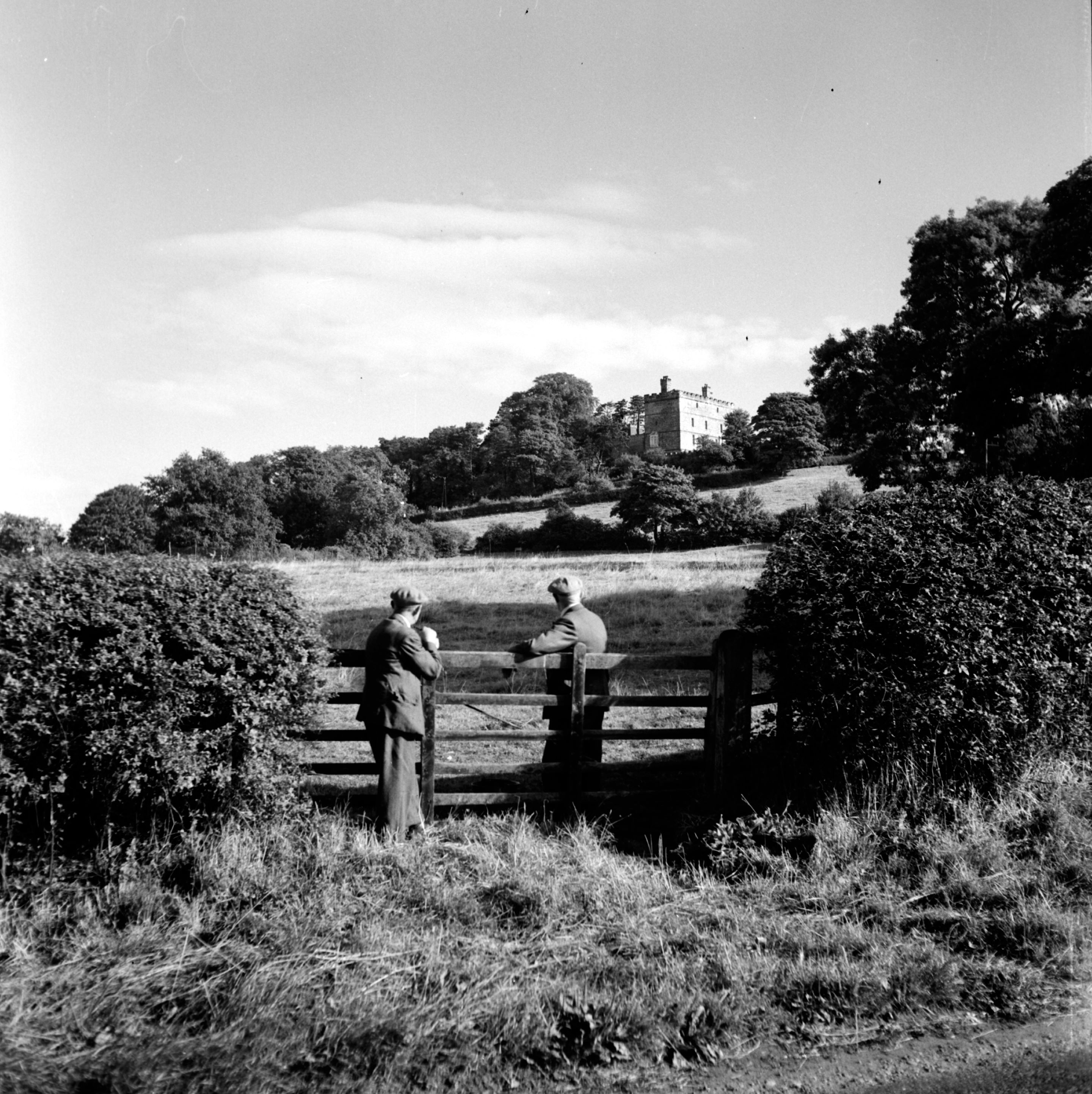 Two gentlemen looking towards Crayke Castle. Taken by local photographer Bertram Unné, active between 1940 and 1979.