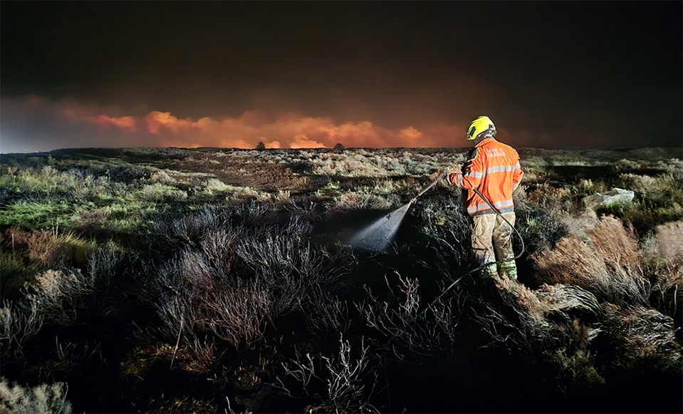 Fire fighter put out moorland fire at night