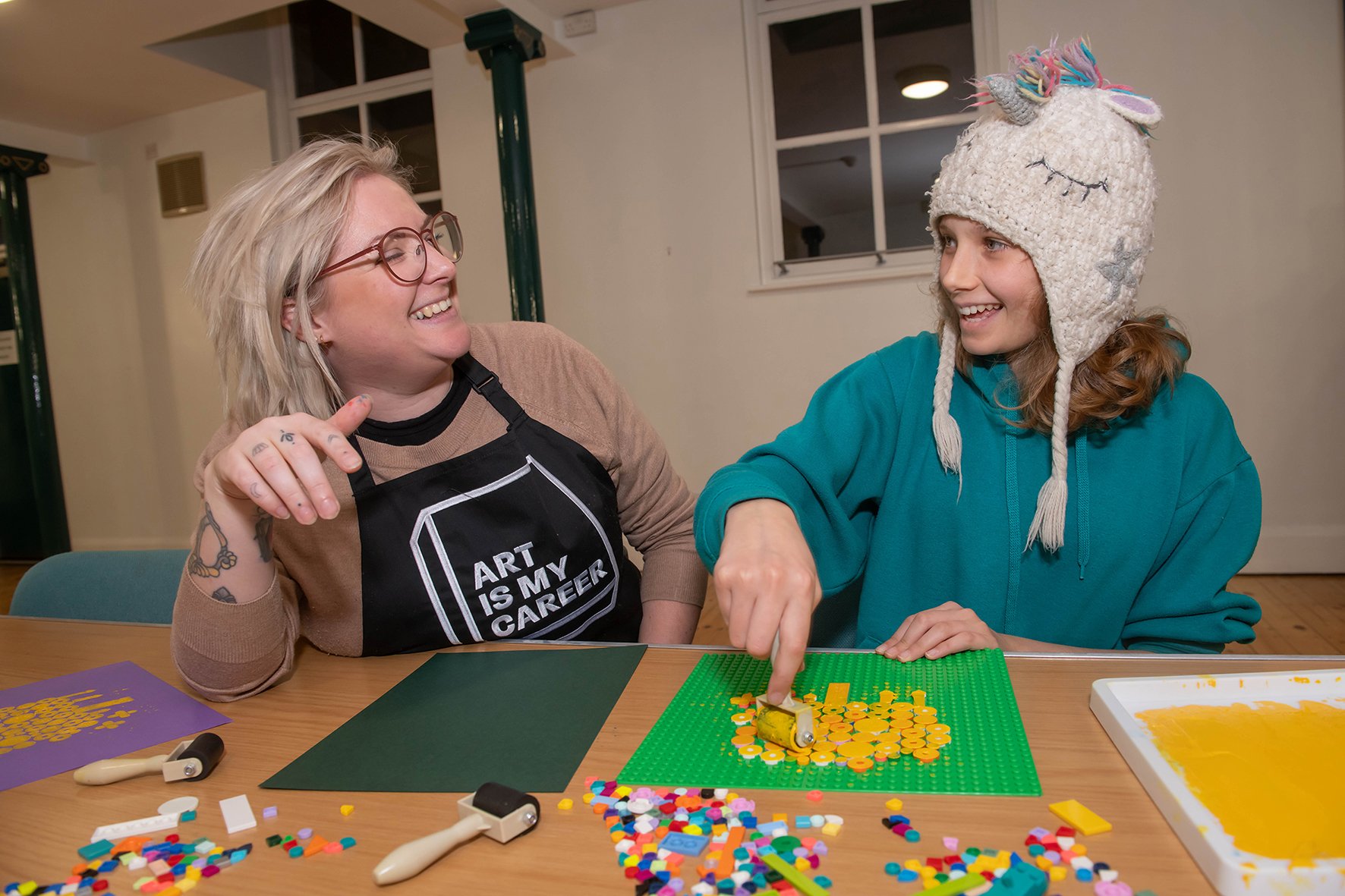 Robyn Corrigan, aged 12, creates artwork at the Lego workshop in Selby with Laura Sanderson.