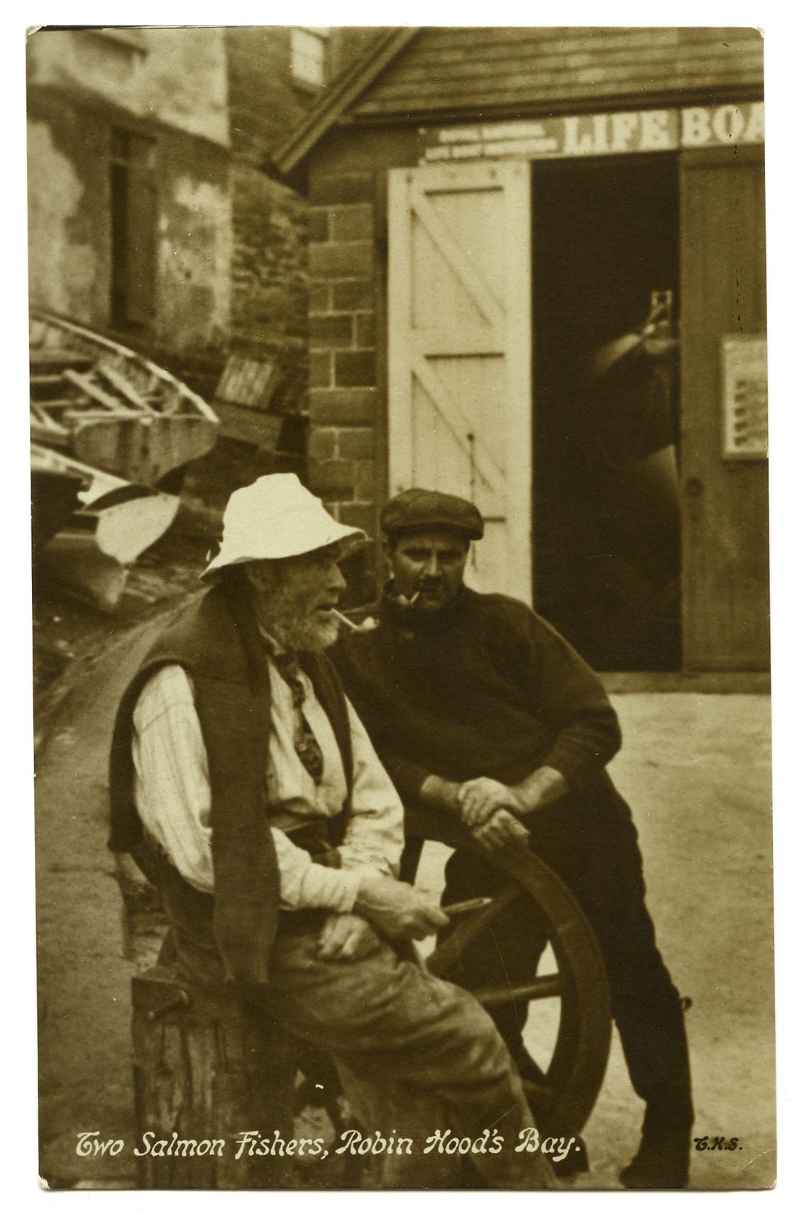 Two salmon fishermen are pictured taking a moment to relax in Robin Hood’s Bay. Taken by W. A. Smith circa 1913.