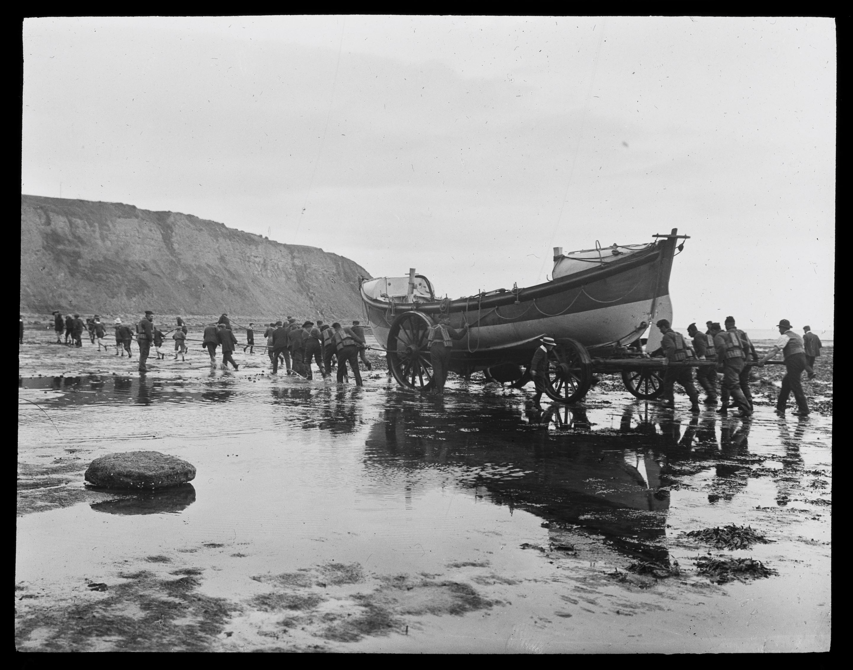 A lifeboat is launched at Robin Hood’s Bay. The photo is undated and was taken by Graystone Bird (1862-1943). It is taken from the ‘Tour of Yorkshire’ photographic collection.