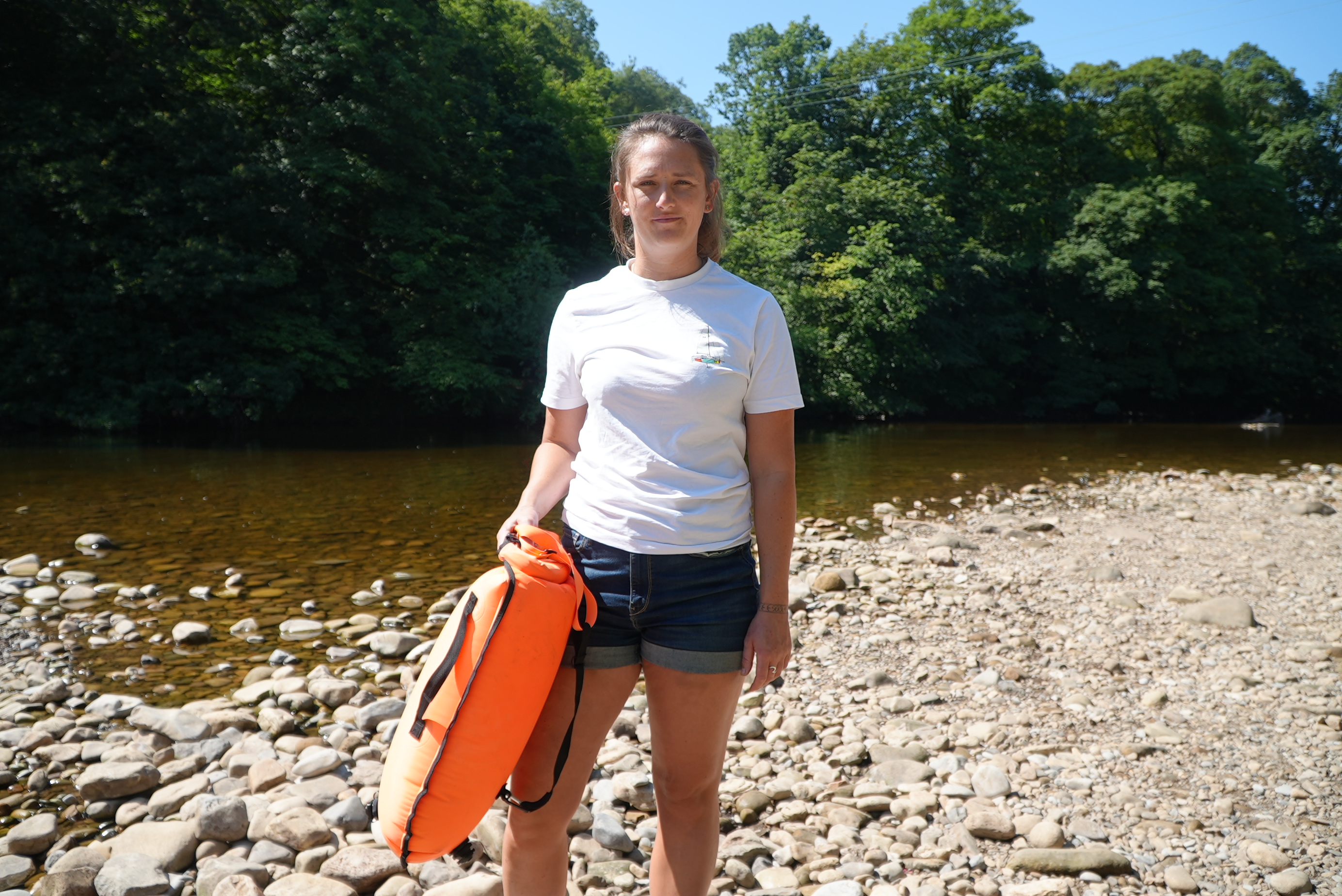 Photo of Jessica Harrison standing beside the river at Richmond Falls