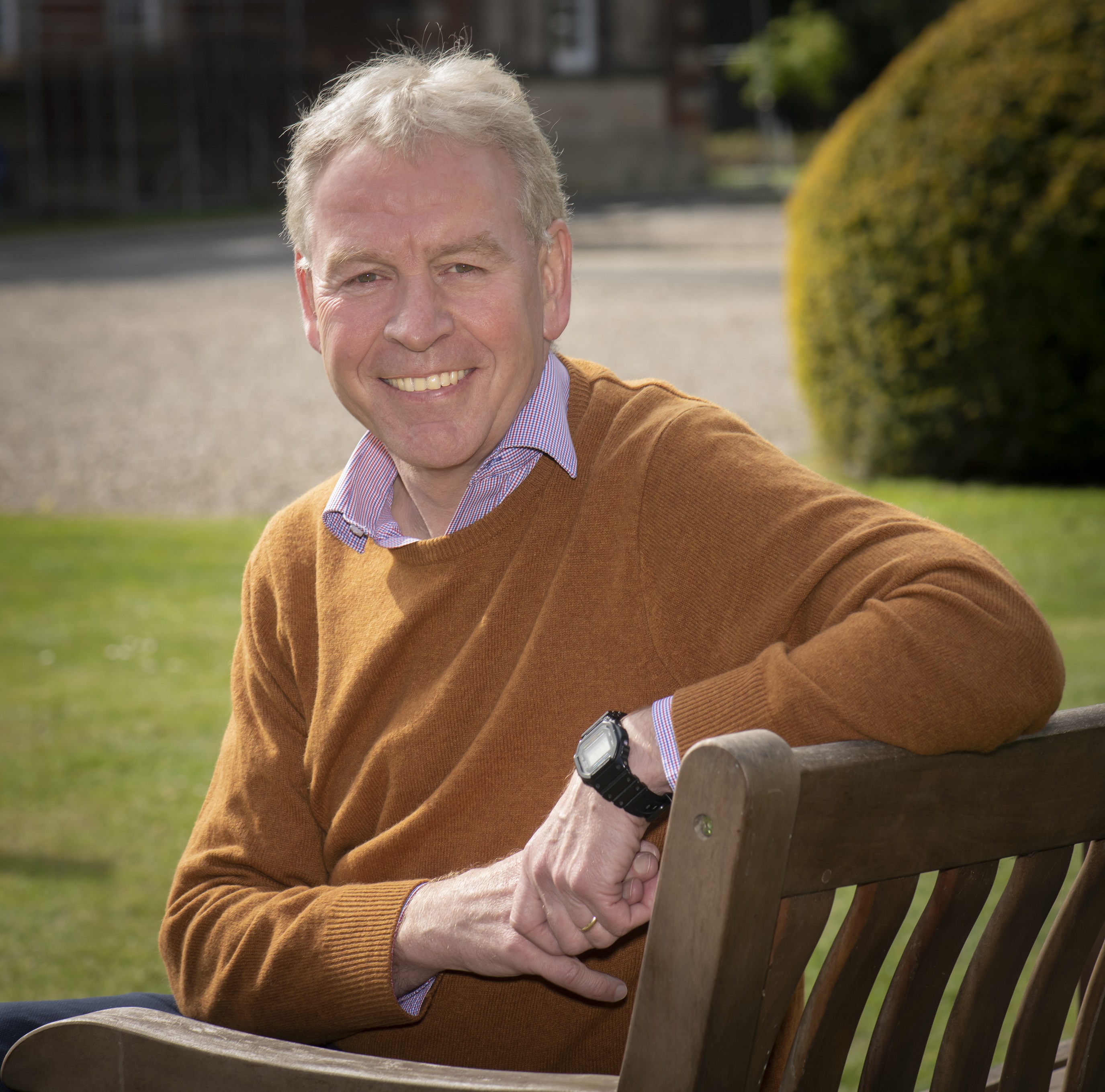 Richard Flinton pictured sitting on a bench in the grounds of County Hall in Northallerton.