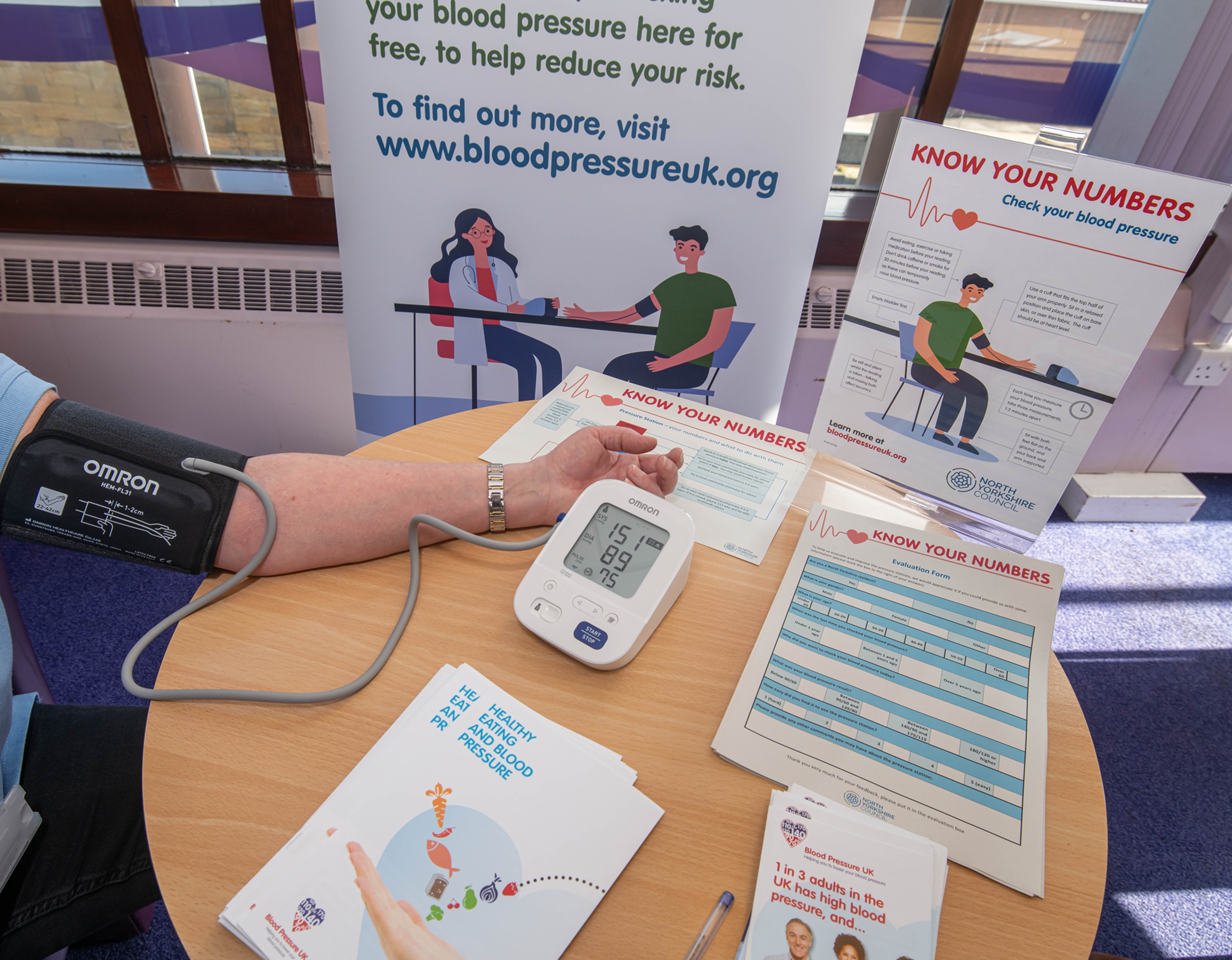 Someone taking a blood pressure reading
