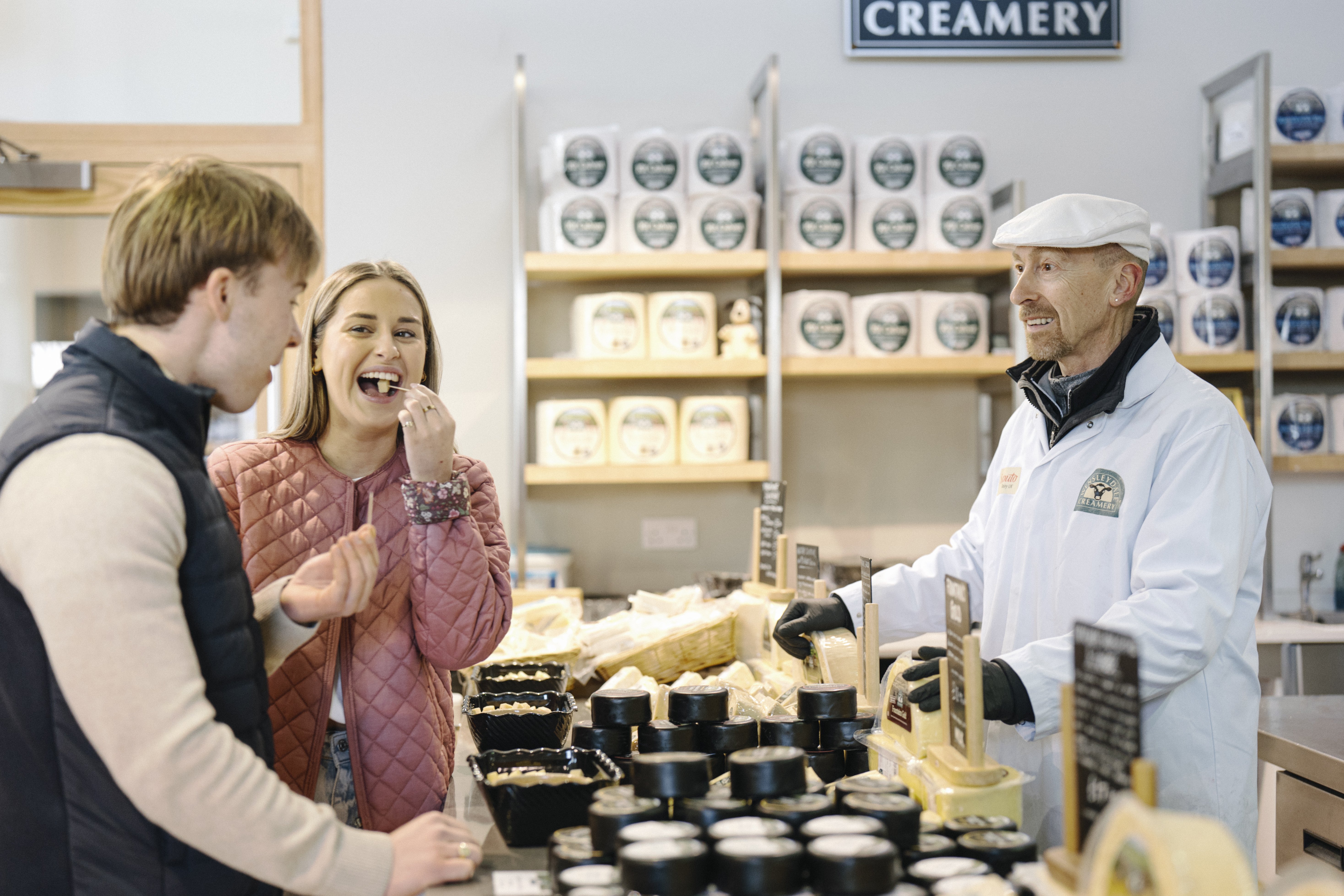 Group of people tasting samples of cheese