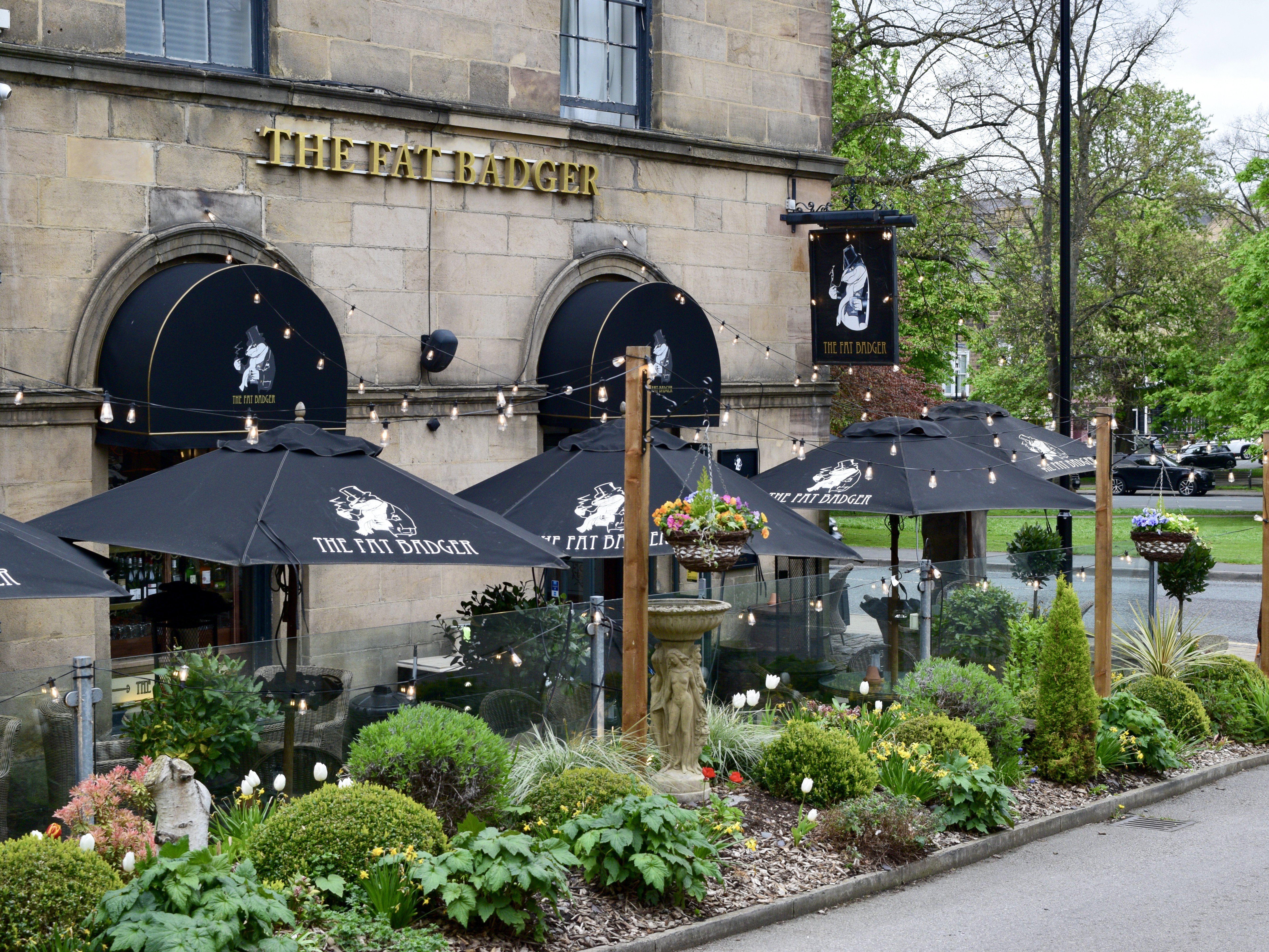 Exterior of The Fat Badger with outdoor seating