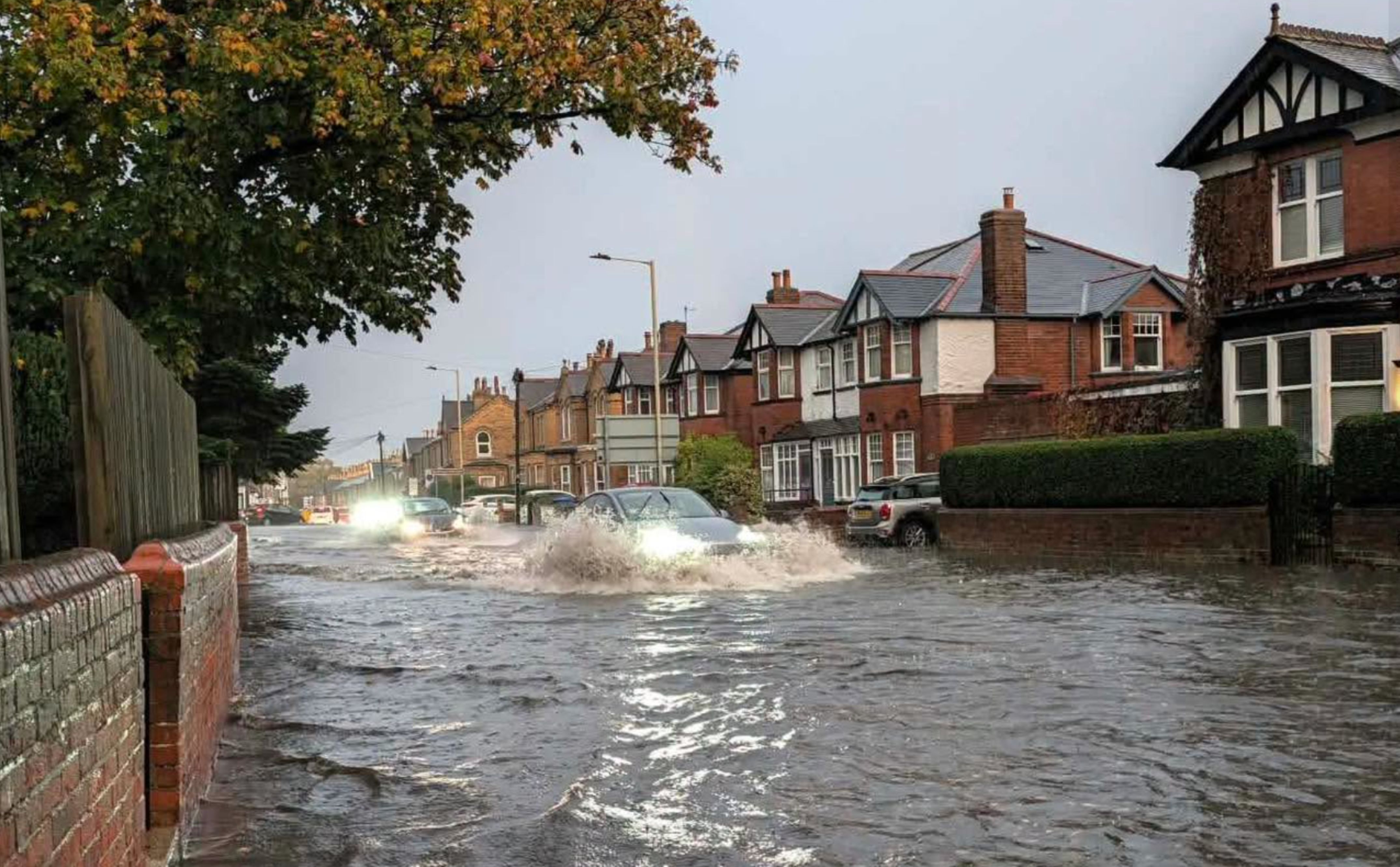 Cars driving through flood water