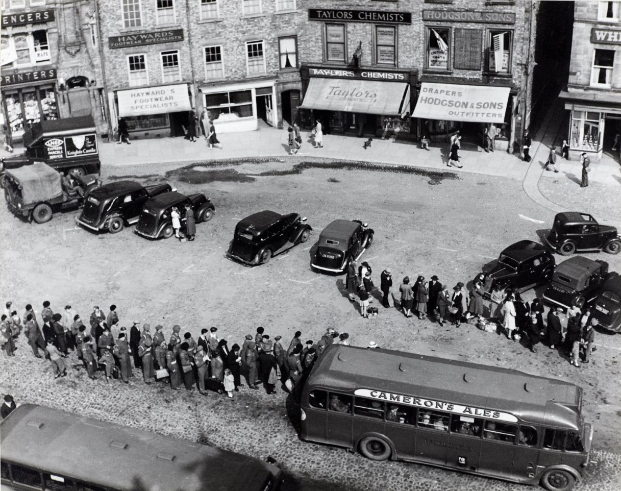 North row of Market Place, Richmond, 1945. From a collection of British Council photographs within Richmond District Council records.