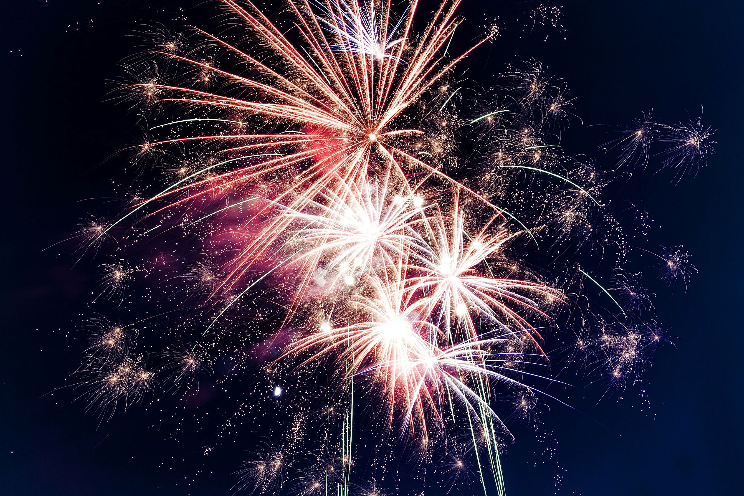 Large firework display filling the night sky