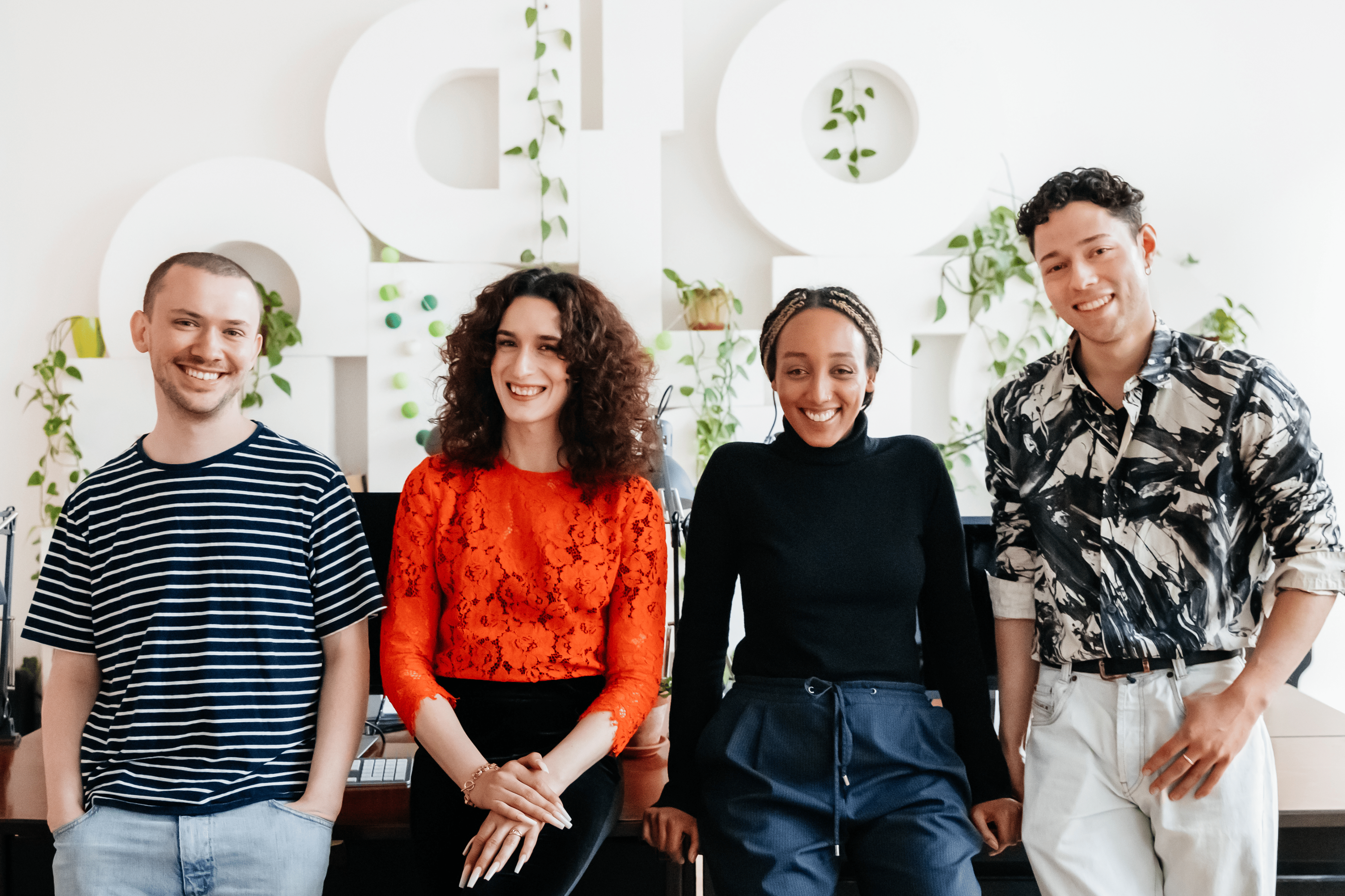 HR Page banner with four people looking towards the camera at ease.