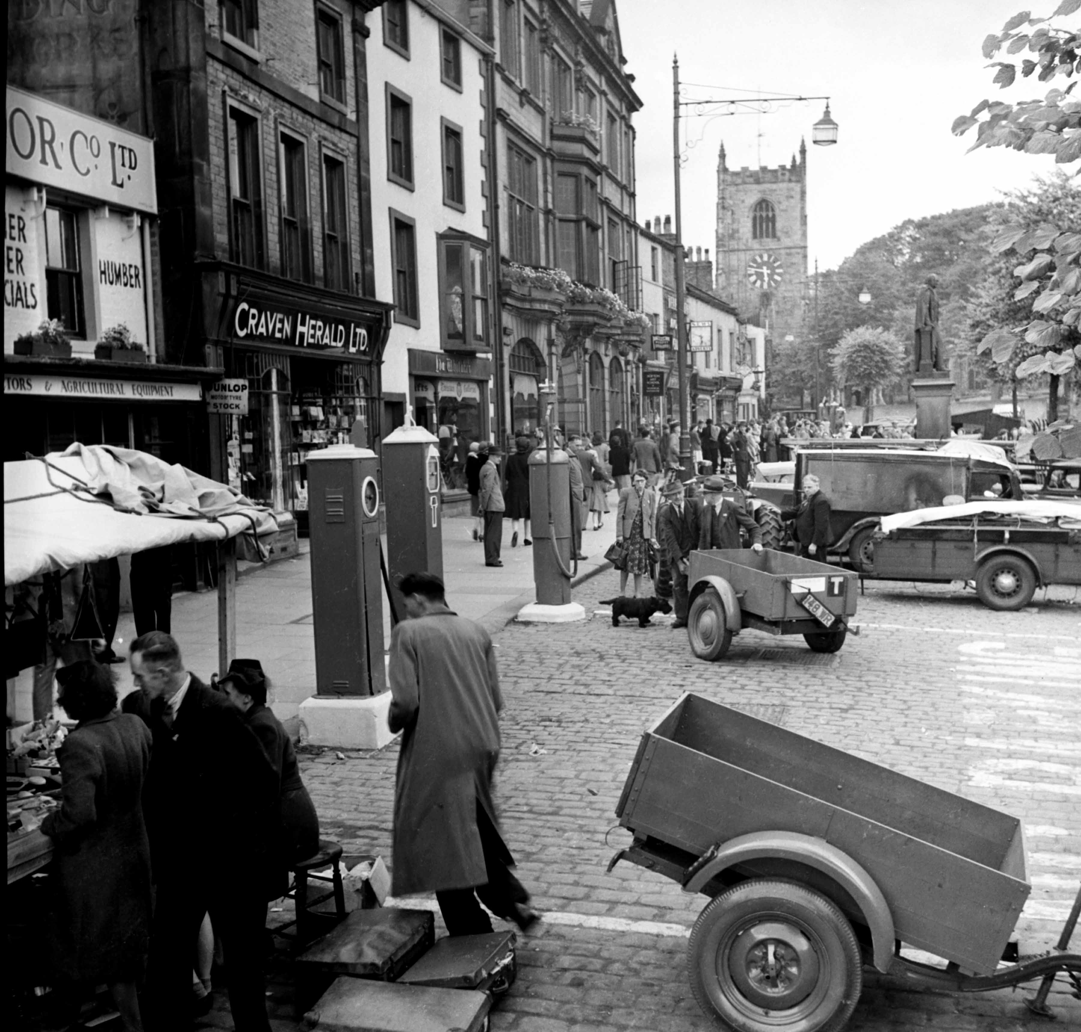 A busy street scene on the High Street, Skipton, c.1950s. Taken by local photographer Bertram Unné, active between 1940 and 1979.