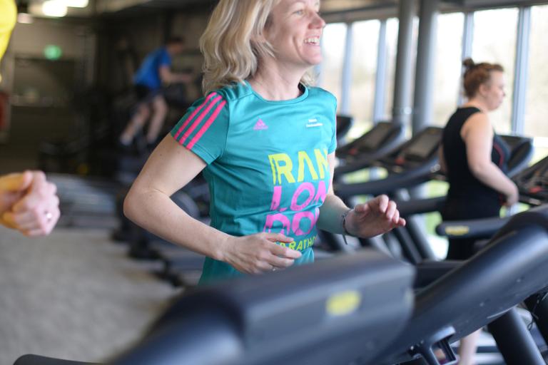 A lady running on a treadmill