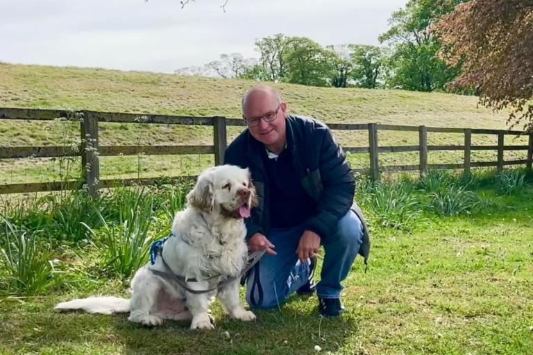 Ian Carman, a volunteer with the independent visitor scheme, and his dog, Morris.