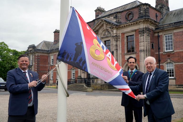 Left to right, Armed Forces champion, Cllr Kevin Foster, vice-chair, Cllr George Jabbour, and council, Cllr Carl Les, at the flag-raising event at County Hall in Northallerton to mark the 80th anniversary of VE Day. 