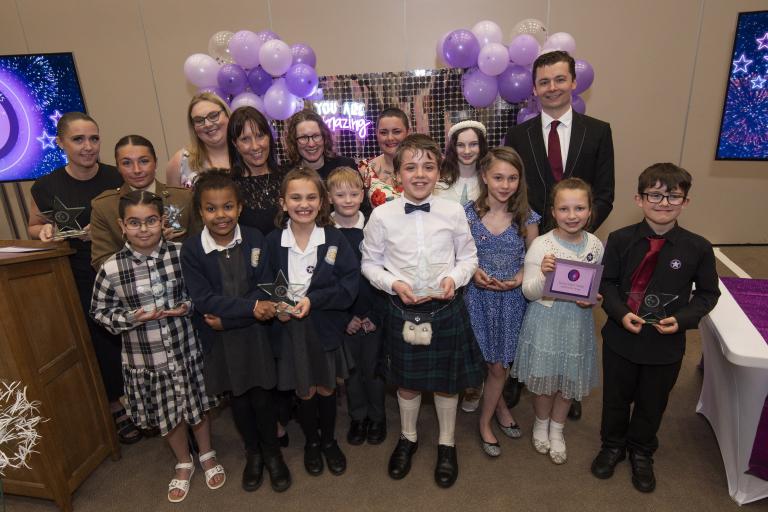 A group of children with awards