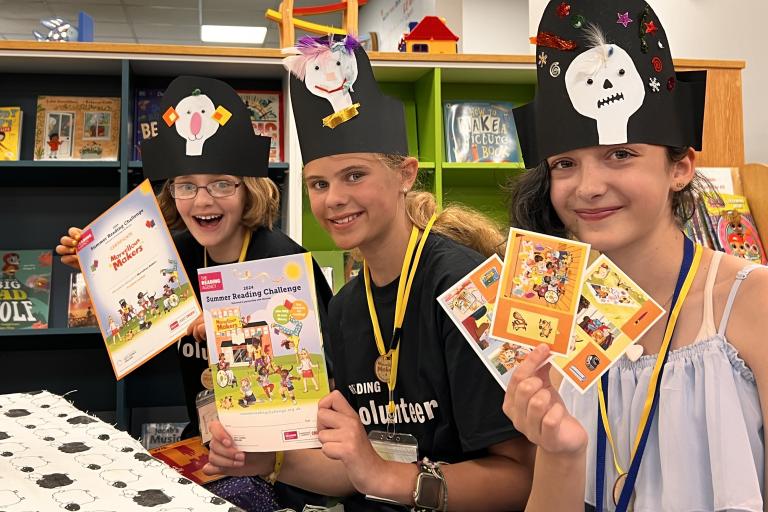 Three young people with books