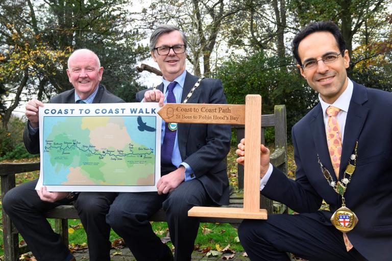 The chair of North Yorkshire Council, Cllr George Jabbour, is joined by his counterparts from Cumberland Council and Westmorland and Furness Council, Cllr Andy Semple and Cllr Doug Rathbone, at County Hall in Northallerton to champion the Coast to Coast Walk which crosses the three areas.