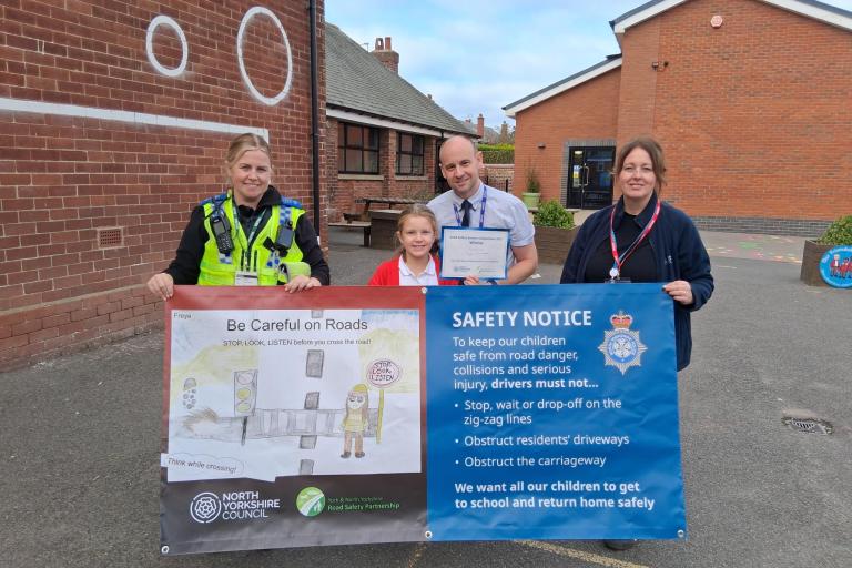  From left, Police Community Support Officer at North Yorkshire Police, Natalie Blacker, Filey Junior School pupil Freya Hammerton, who is the winner of the banner competition, headteacher Michael Taylor, and community safety officer at North Yorkshire Council, Karen Nattress.