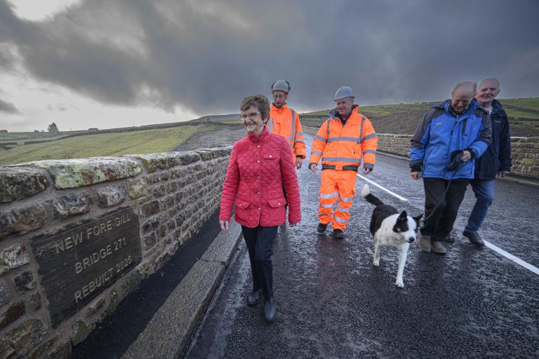 From left, Cllr Yvonne Peacock, head of bridges, Phil Richardson, Cllr Malcolm Taylor, with residents Anthony Hird and Ron Woolford, walking along the new bridge. 