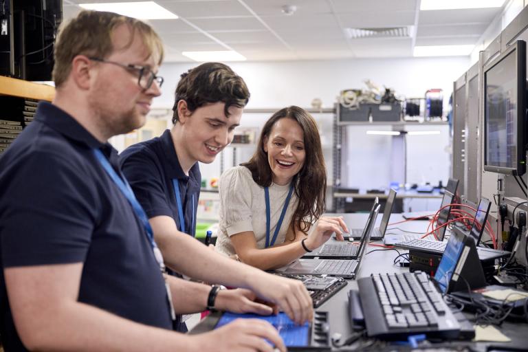 Madeline, James and Thomas using a computer