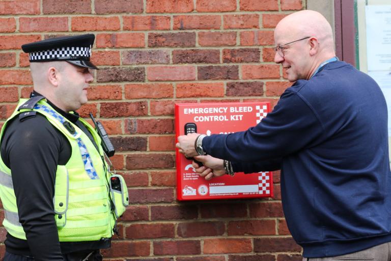 PC Paul Mushens, of North Yorkshire Police, is shown the Daniel Baird Foundation #controlthebleed kit by North Yorkshire Council’s community safety officer, Philip Wright, in the Market Place, Thirsk