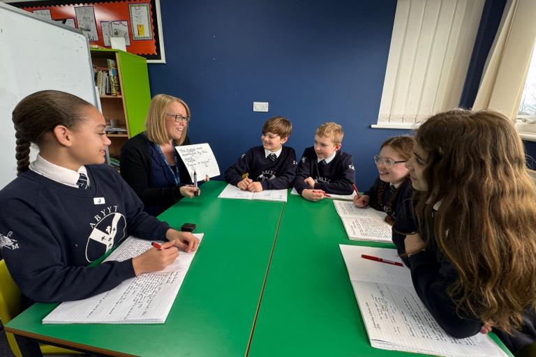 Children sat around a table at St Martins School