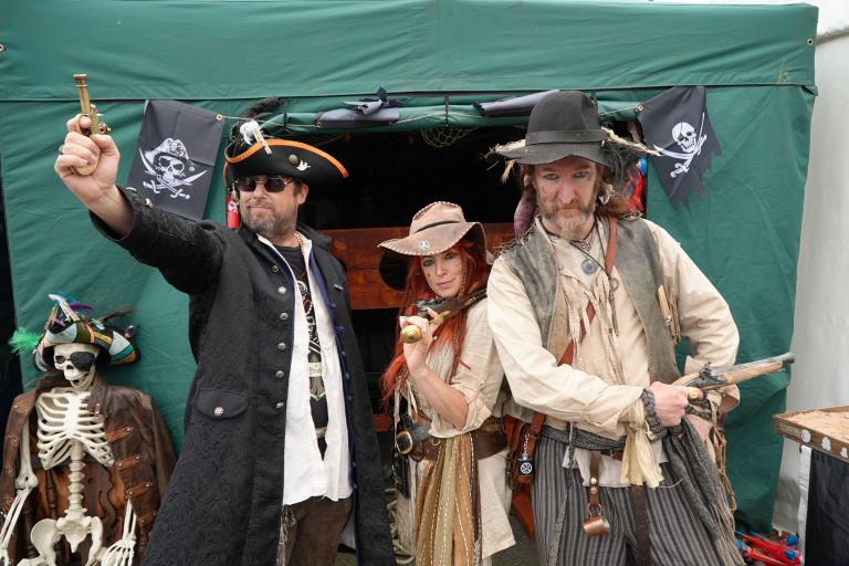 Three people dressed as pirate at Whitby Fish and Ships Festival
