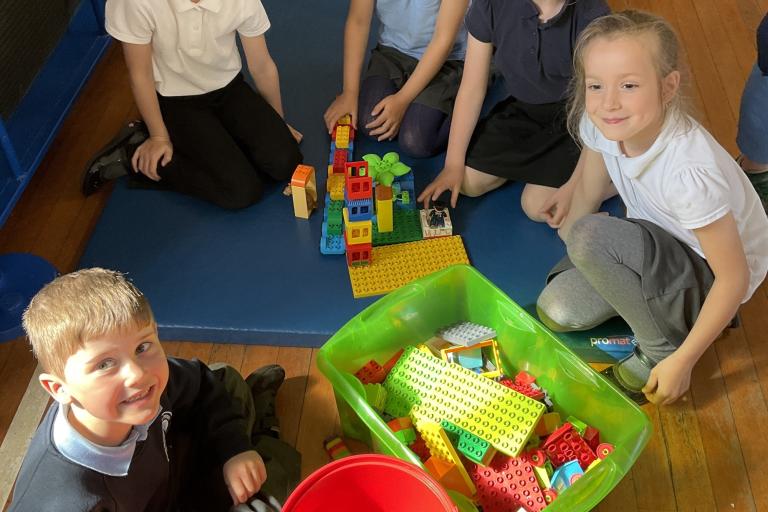 School children in a circle playing