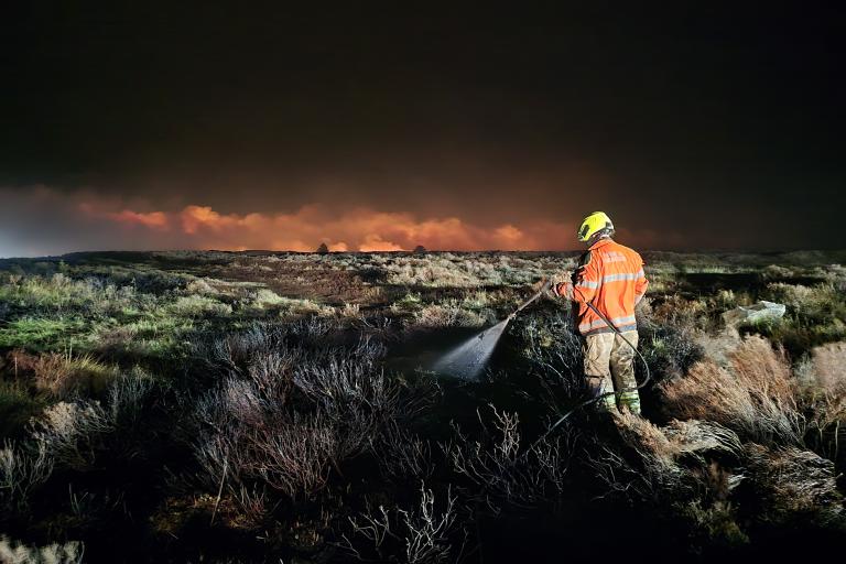 A firefighter with the moors fire - Credit Paul Edwards