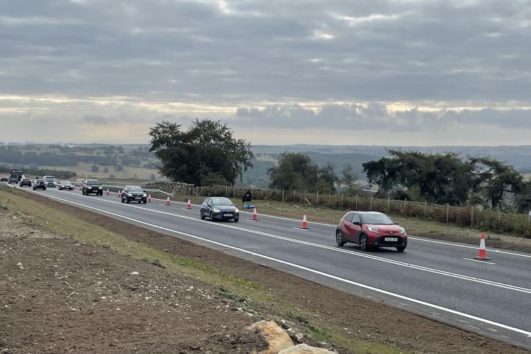 Traffic is pictured travelling along the new stretch of the A59 at Kex Gill today (Tuesday, August 25). The route is seen as one of the most strategically important highways in the country linking the east and west of England.