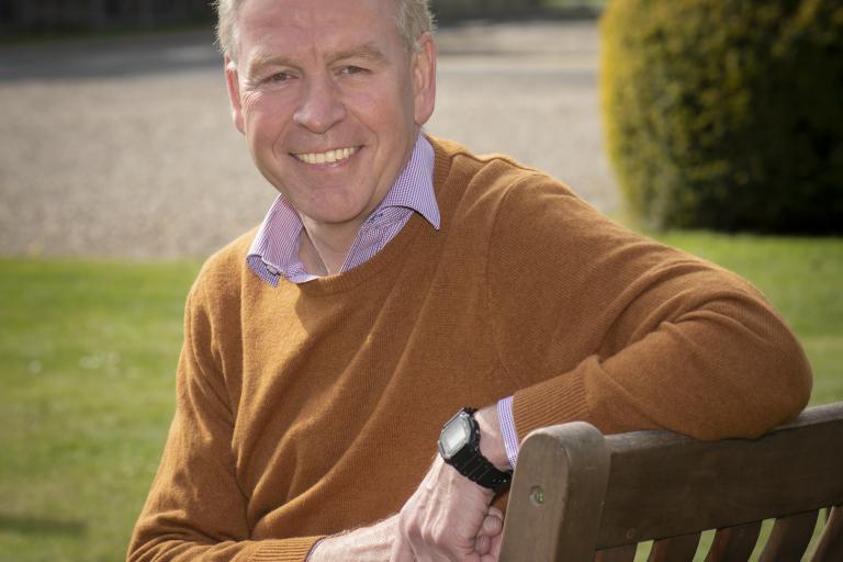 Richard Flinton pictured sitting on a bench in the grounds of County Hall in Northallerton.