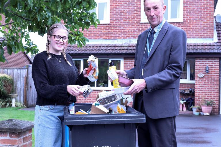  resident Alexis Flint shows how to recycle waste correctly with North Yorkshire Council’s executive member for managing our environment, Cllr Richard Foster.