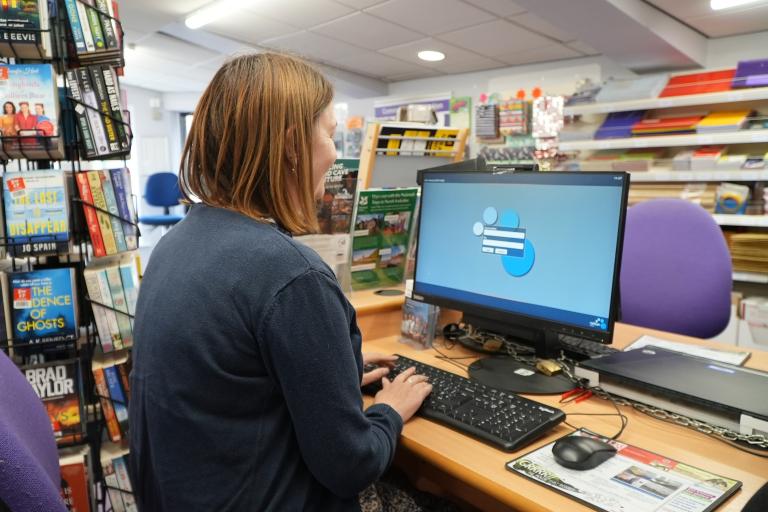 A lady at a computer