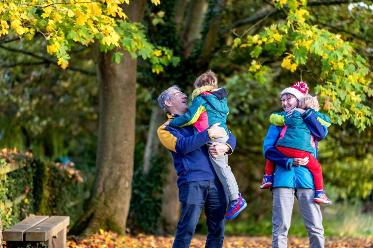 A family of four in the woods