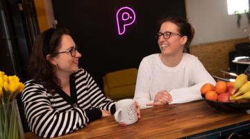 Two people sitting at a table