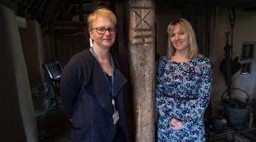 Outreach librarian at North Yorkshire Council, Fiona Diaper (left), and marketing and events co-ordinator at Ryedale Folk Museum, Rosie Barrett, next to a witch post at the museum. 