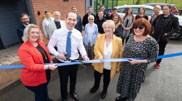 Cutting the ribbon at the opening of Eastside Community Hub