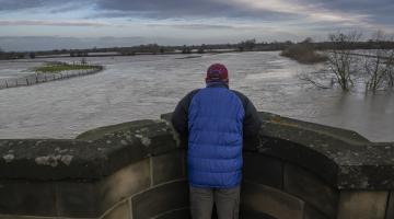 A person looking at flooding in North Yorkshire