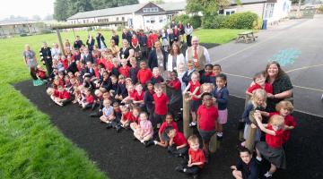 Council’s assistant director for education and skills, Amanda Newbold, with headteacher Mrs Julie Lyon, celebrating the top Ofsted rating with delighted pupils and staff at Dishforth Airfield Primary School. 