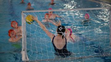 Members of the water polo club in action.