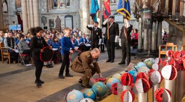 2.	Children from Wavell and Risedale schools lay wreaths with Catterick Garrison’s Commander, Lt Col Charlie Anderson,