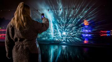 A visitor to Peasholm Park is pictured taking a photograph of the illuminated artworks as part of the Scarborough Lights festival. 
