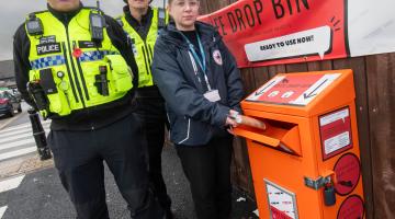 Community safety officer, Evie Griffiths, with North Yorkshire Police officers, PCs Kelvin Troughton and Brendon Frith, at the knife drop bin in Harrogate