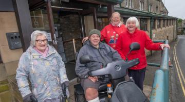 Rose Mary Baxter, Burke Smith, Hazel Drew and Jean Rowley outside the new accessible doors at Grassington Town Hall.