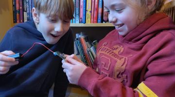 Max and Maya learning with micro:bits, which they borrowed from Scarborough Library.