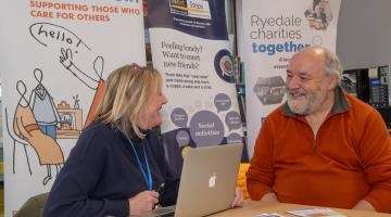 Heather Witty, Ryedale Carers Support coordinator, chatting to library visitor David Swann about the services on offer. 