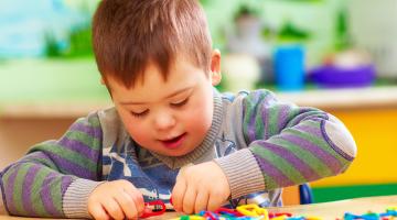 A young boy with  bright coloured clips