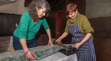 Sarah Priestley, left, and Viv Mousdell work on an arts project as part of The Living on the Edge of the World festival in Whitby. 